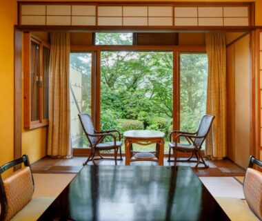 Traditional tatami room with low table, shoji screens and garden view at Hakone Kowakien Mikawaya Ryokan in Kanagawa