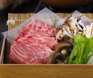 Thinly sliced marbled beef with mushrooms and greens in wooden tray, Hakone Kowakien Miyamafurin, Kanagawa Japan