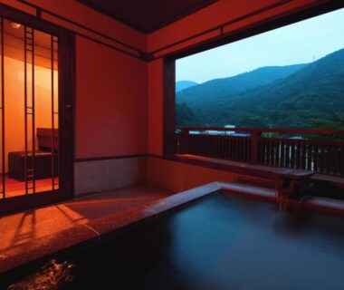 Wooden onsen bath opening to balcony with mountain view at Hakone Onsen Ryokan Yaeikan, Kanagawa