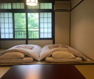 Traditional tatami room with two futons, shoji screens and garden view at Hakone Onsen Yuyado Yamanoshou, Kanagawa