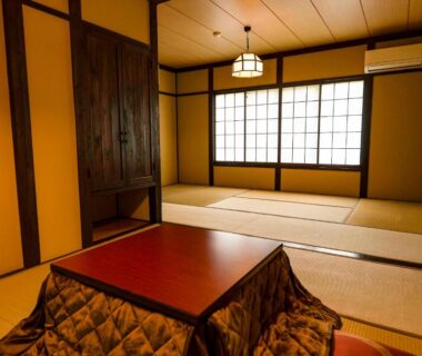 Tatami room with low kotatsu table and shoji screens at Hakone Onsen Yuyado Yamanoshou, Kanagawa, Japan