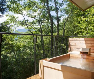 Wooden soaking tub on deck at Hakone Retreat villa 1/f overlooking Kanagawa forest