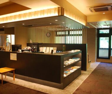 Reception counter with brochures and bench seating at Hakone Suimeisou, Kanagawa, Japan
