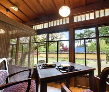 Tatami seating and low table overlooking garden at Hakone Suishoen, Kanagawa, Japan