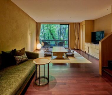 Modern tatami seating area with low table, sofa and garden view at Hakone Suishoen in Kanagawa