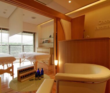 Twin treatment beds with wooden interior and balcony view at Hakone Tokinoshizuku in Kanagawa