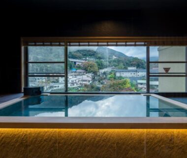 Indoor onsen bath facing town and hills at Hakone Yumoto Onsen Hotel Kajikaso, Kanagawa, Kantō, Japan