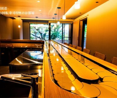 Long wooden dining counter with flowing water channels at Haku Fuji Yamanakako in Yamanashi