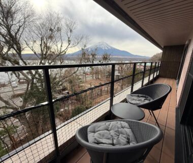 Balcony chairs overlooking lake and distant mountain at Haku Fuji Yamanakako Yamanashi