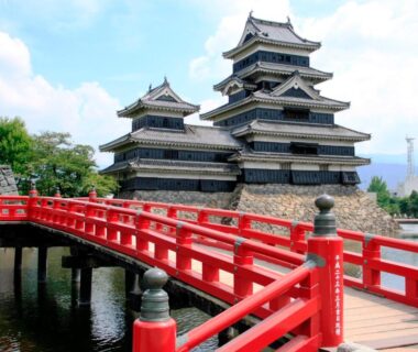 Red arched bridge leading to a castle near Hakuraiso in Nagano, Chūbu region