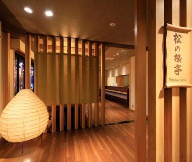 Lantern-lit wooden foyer leading to entrance of Hamabeno Ryouriyado Houraikan in Iwate, Tōhoku