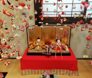 Traditional hina doll display with hanging fabric ornaments on tatami platform at Hamayuu, Shizuoka, Chūbu