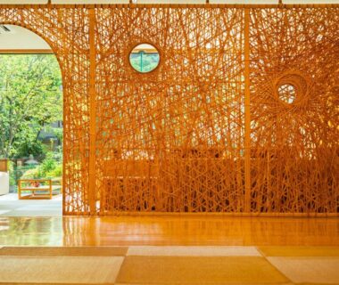 Tatami flooring, woven bamboo partition and garden view at Hana Beppu ryokan in Oita, Kyushu