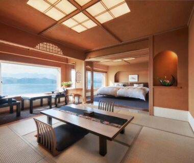 Tatami room with low table and sea view at Hana Irodori no Yado Kayuu, Wakayama