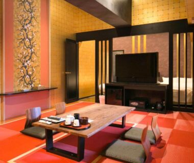 Tatami room with low table, floor cushions and sliding screens at Hana No Shizuku in Saga, Kyushu
