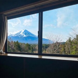 Snow-capped mountain visible through ryokan room window at Hanamizuki in Yamanashi, Chūbu