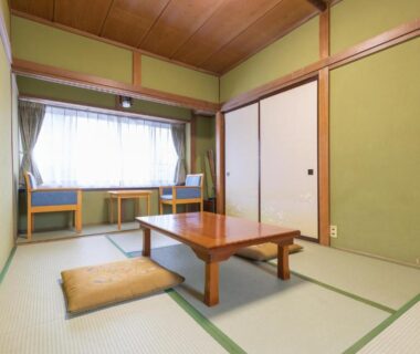 Traditional tatami room with low table, floor cushion and window seating at Hanamizuki in Yamanashi, Chūbu