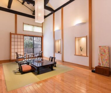 Low tatami seating with shoji screens and garden view at Hanare Yado Yosizumi in Shizuoka