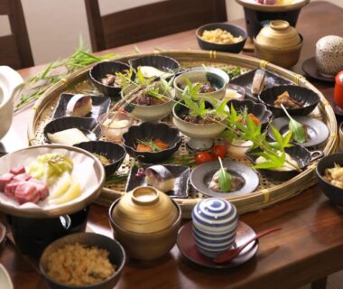 Assorted small Japanese dishes on low wooden table at Hanasuishou, Yamanashi, Chūbu Japan