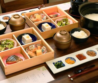 Wooden bento boxes and rice pots arranged for a ryokan meal at Hanasuishou in Yamanashi Chūbu