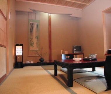 Traditional tatami room with low dining table, zabuton cushions, tokonoma alcove and shoji screens at Hanaya Tokubei in Nara