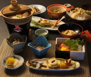 Assorted small Japanese dishes and tabletop simmer pot at Hanaya Tokubei in Nara