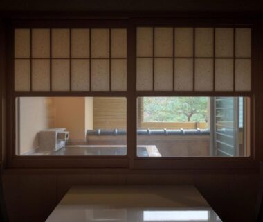 Shoji window framing wooden tub and table at Harumiya Ryokan Fukushima