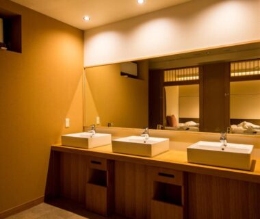 Three washbasins with wood vanity at Hatagoya Jozankei Shoten, Hokkaidō Japan