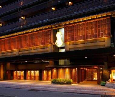 Lit wooden facade and entrance of Hatori ryokan in Ishikawa, Chūbu region