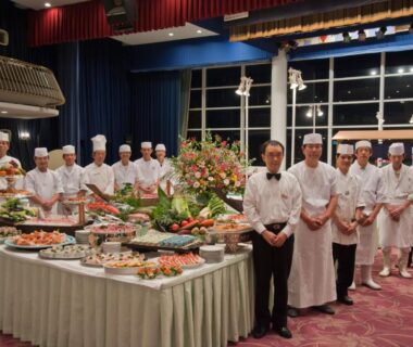 Chefs standing behind a large buffet spread in a banquet hall at Hatoya Hotel, Shizuoka