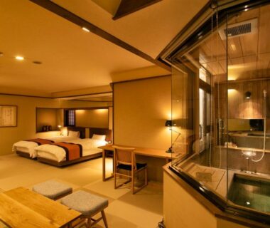 Spacious tatami room with twin beds and in-room wooden bath, soft ambient lighting, Hayamakan Yamagata