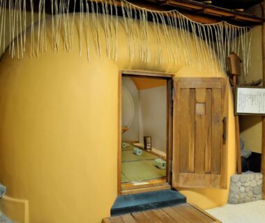 Small earthen tea room entrance with tatami interior at Heihachi Tea House Inn in Kyoto