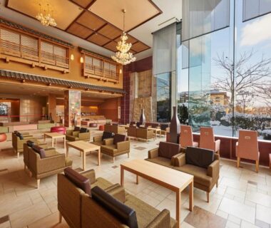 Bright lobby seating area with floor-to-ceiling windows at Heiseikan Kaiyotei Hokkaidō