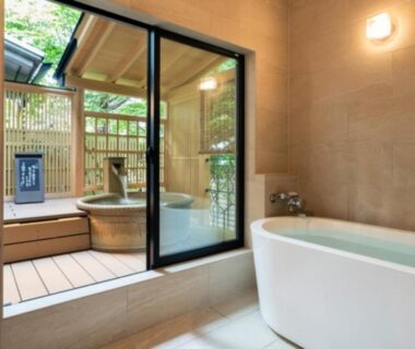 Indoor freestanding bathtub and wooden outdoor tub with bamboo fence at Hibikino, Gunma