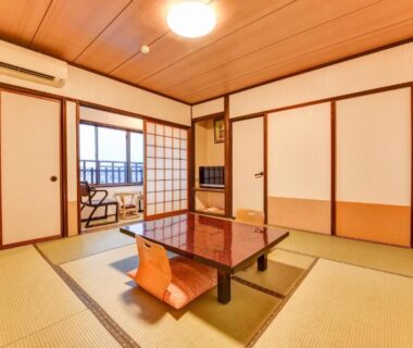 Traditional tatami room with low table and shoji screens at Hidatakayama Futarishizuka Hakuun in Gifu
