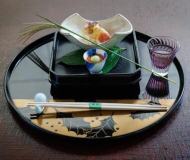 Lacquer tray with small appetizers, chopsticks and glass cup at Hiiragiya Kyoto, Kansai Japan