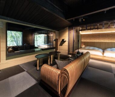 Tatami seating area, low beds and wooden bath at Hikyou Shirakawagensen Sansou Takefue in Kumamoto, Kyushu