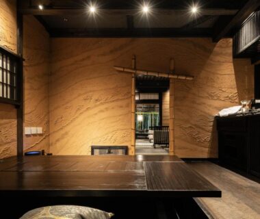 Low wooden dining table with floor seating at Hikyou Shirakawagensen Sansou Takefue in Kumamoto, Kyūshū