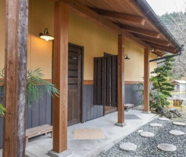 Wooden porch and stepping stones at Hirayama Onsen Ryokan Kadoya in Kumamoto