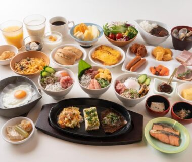 Assorted Japanese breakfast dishes at Hirayukan with grilled fish, egg, rice and small bowls