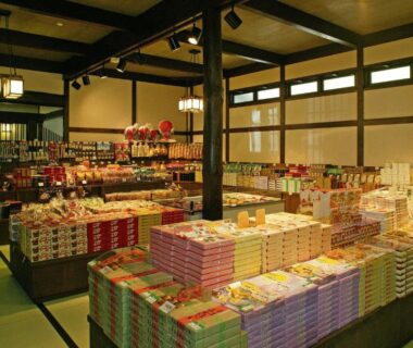 Souvenir display on tatami floor with stacked gift boxes at Hirayunomori, Chubu Gifu