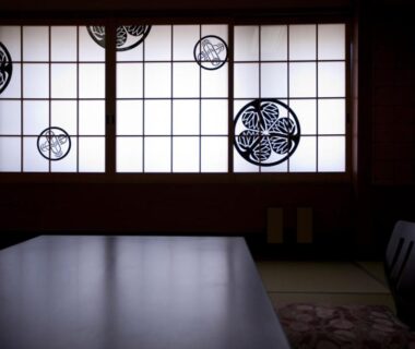 Dimly lit tatami room with shoji screens at Hitomaru Kadan in Hyōgo, Kansai, Japan
