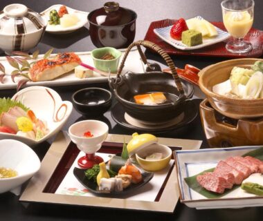 Assorted Japanese dishes on lacquer trays at Honjin Hiranoya Kofukan, Gifu, Chūbu
