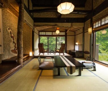Traditional tatami room with low table, shoji screens and garden view at Honke Bankyu in Tochigi