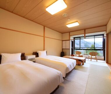 Twin beds on tatami floor with low table and balcony, Hot Spring Inn Hakone Suisen, Kanagawa