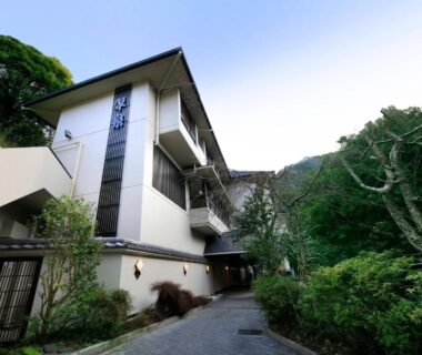 Multi-story exterior with pathway and surrounding greenery at Hot Spring Inn Hakone Suisen, Kanagawa