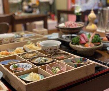 Wooden multi-dish tray of Japanese appetizers at Hot Spring Inn Hyoutan, Gunma ryokan dining table