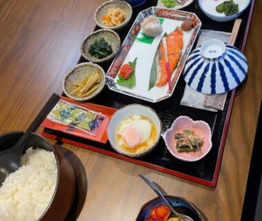 Assorted Japanese breakfast dishes on lacquer tray with grilled fish, rice and miso soup at Hot Spring Inn Hyoutan, Gunma