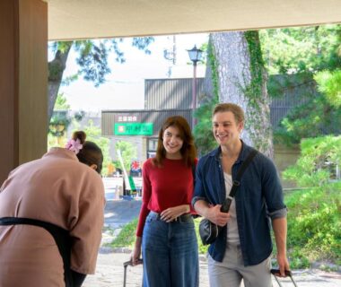 Couple greeted by bowing staff at Hotel Hagoromo entrance in Shizuoka, Chūbu region, Japan
