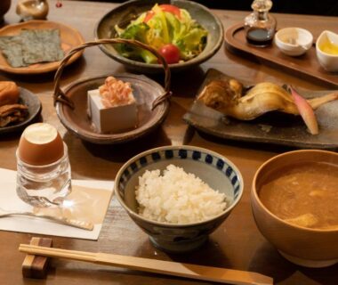 Traditional Japanese breakfast with rice, miso soup, grilled fish at Hotel Hanakoyado in Hyōgo, Kansai